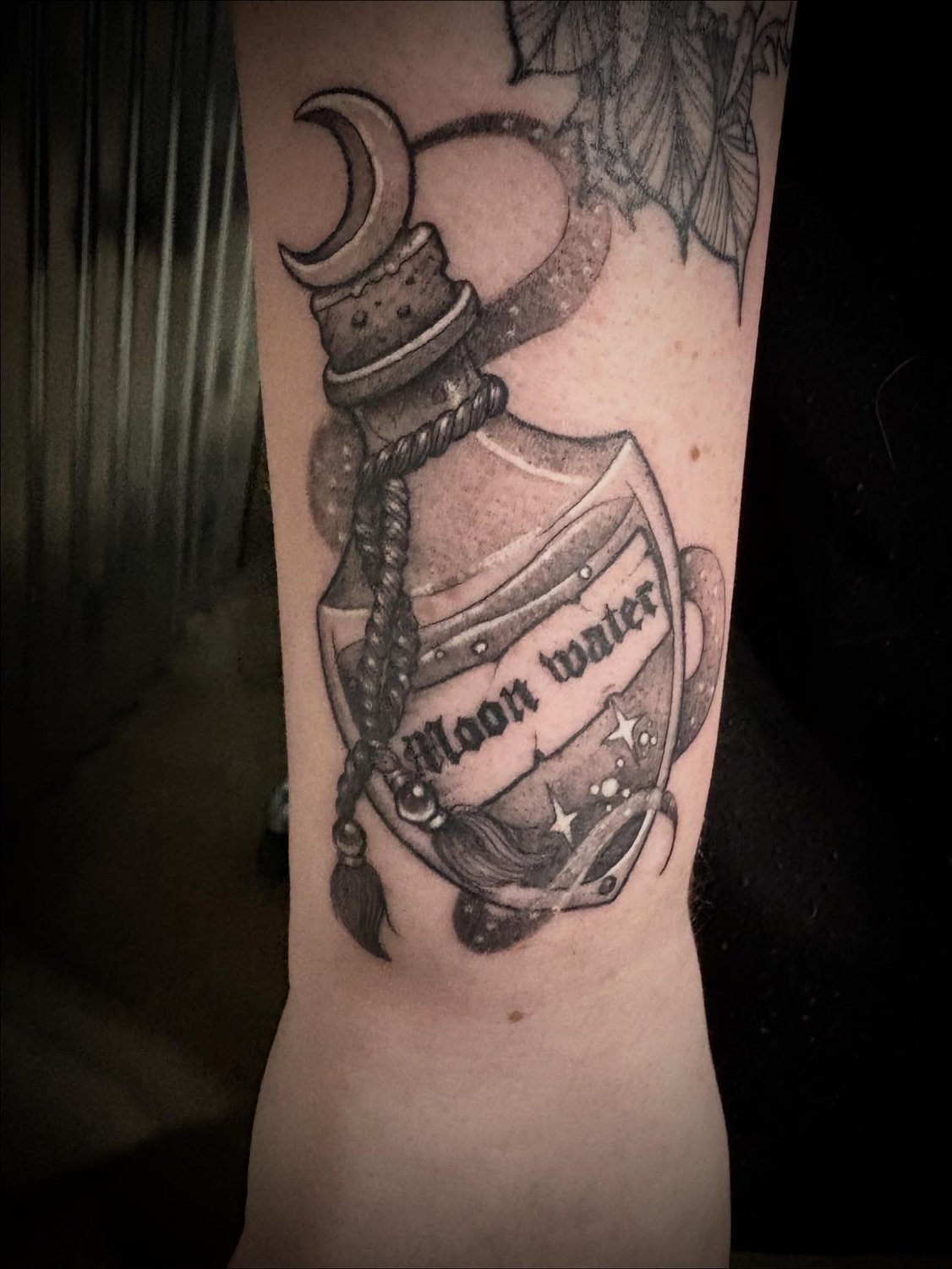Moon-water potion bottle tattoo on Instagram