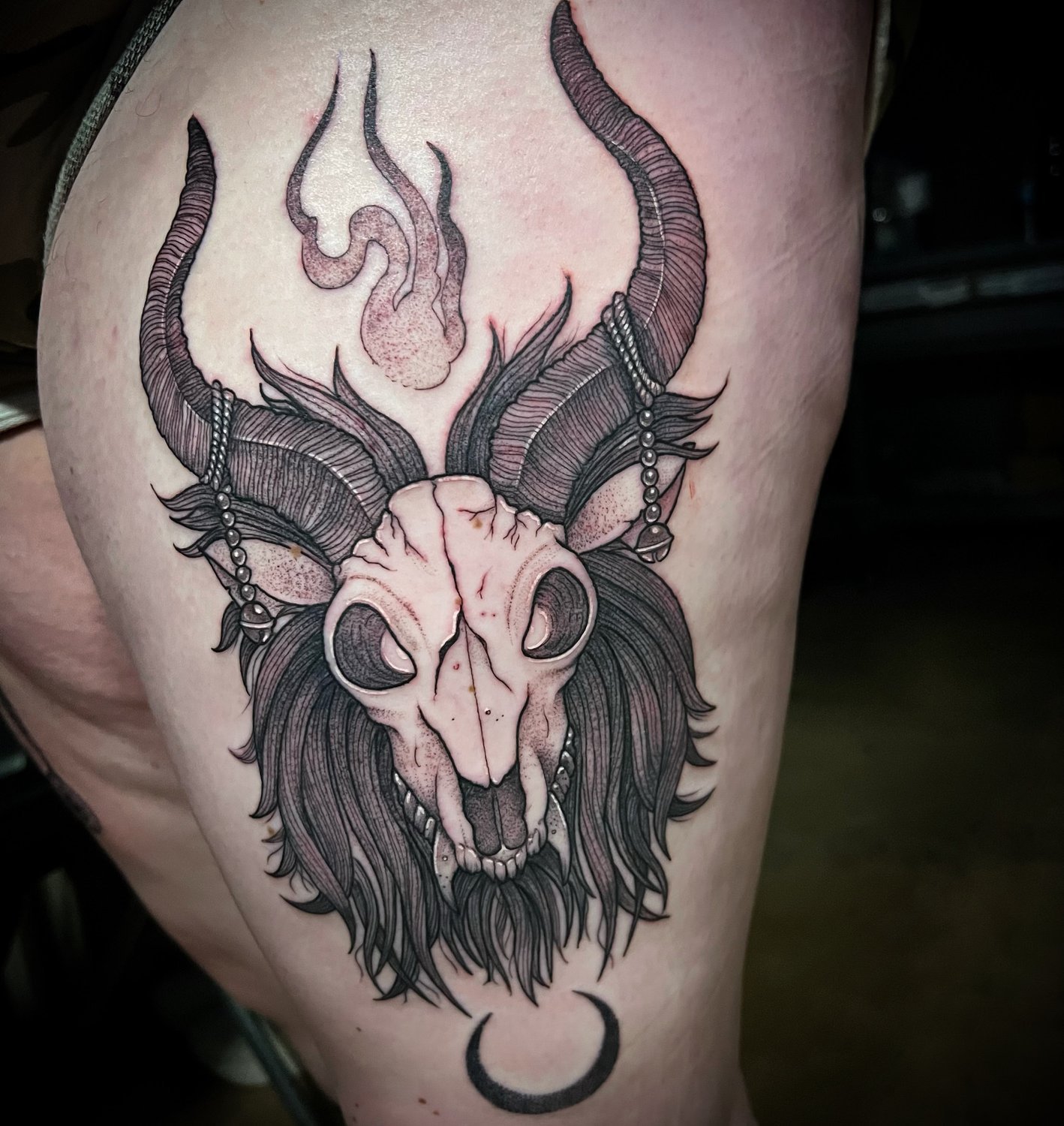 Horned ram skull with beads and a crescent moon